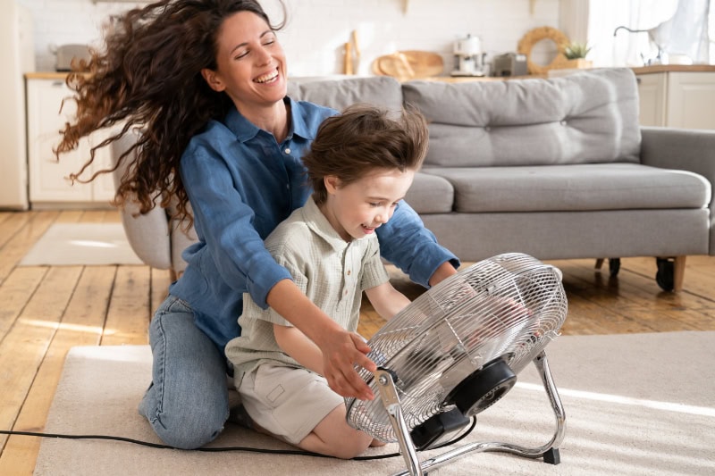 Loving mom relax and having fun with child at home.
