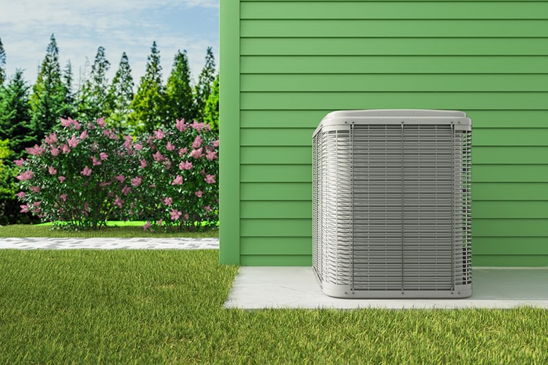 air conditioner sitting outside of a home.