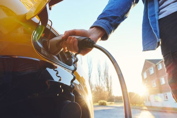 Image of someone charging at ev charging station. Do I Need an Electric vehicle (ev) charging Station?